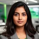 Portrait of Amina Patel in a modern consulting office with a calm, focused expression